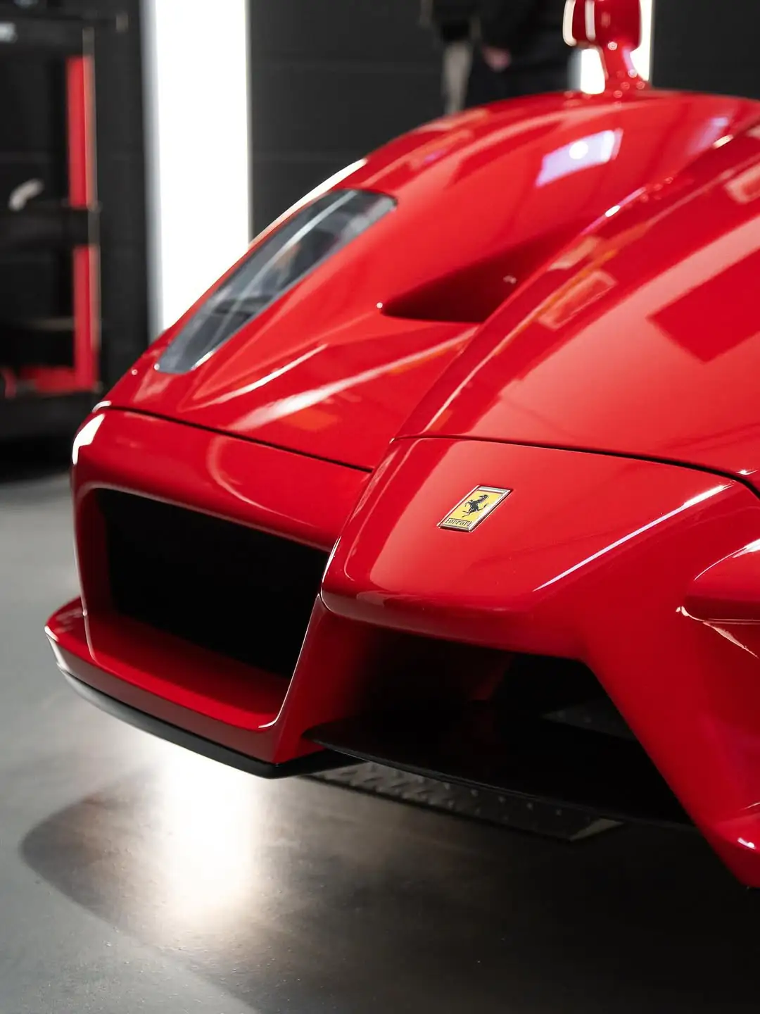 Detail view of the front fascia and emblem of a classic Ferrari