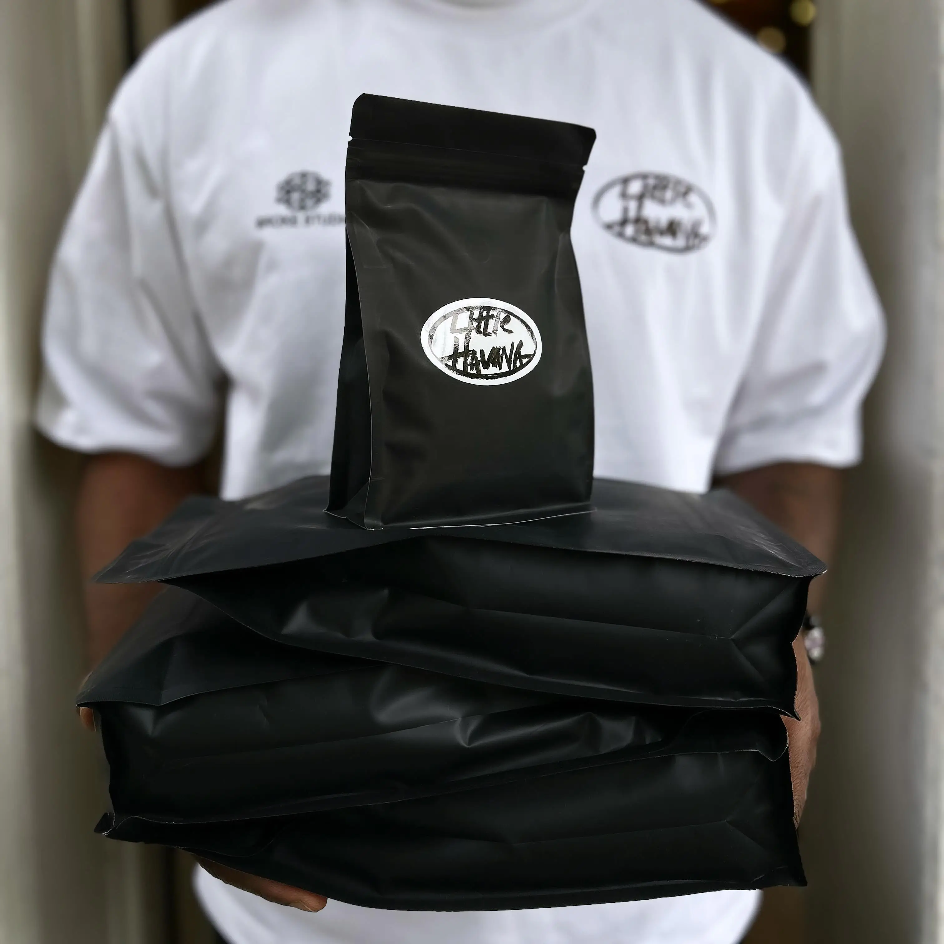 Barista holding Little Havana coffee beans