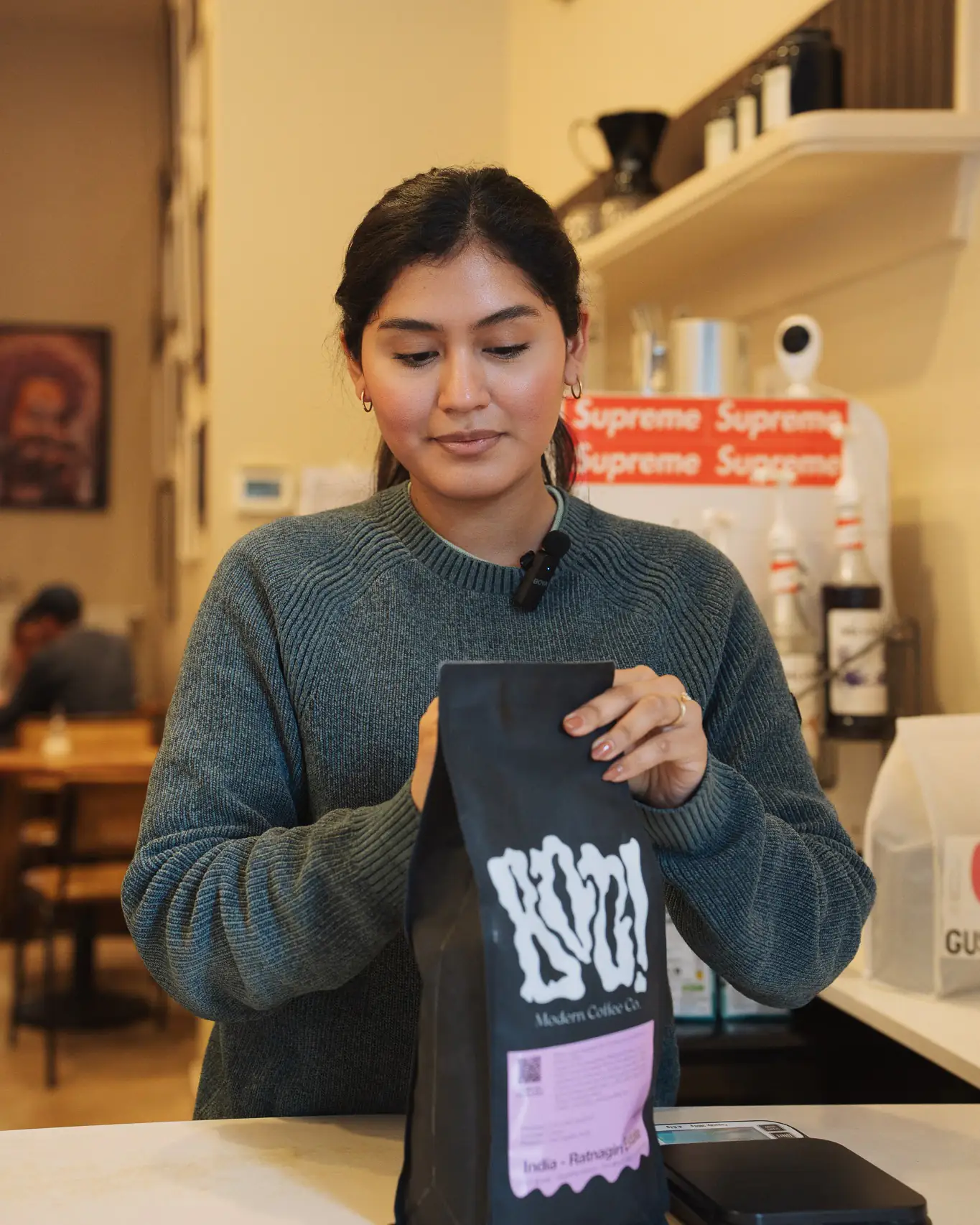Barista showing coffee beans