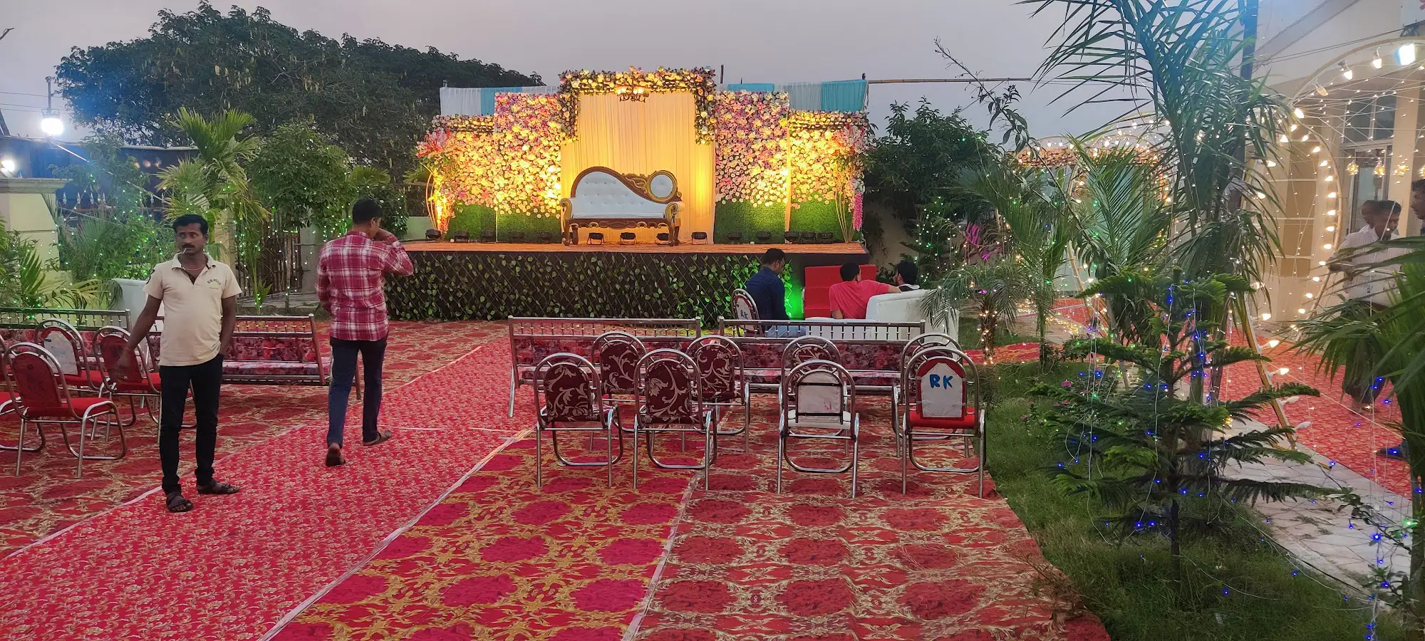 Outdoor event venue at Royal Palace Motel with colorful decorations and festive lighting at dusk